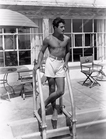 handsome Gilbert Roland by the swimming pool 8b20-9481