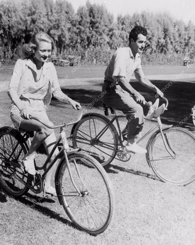 Constance Bennett Gilbert Roland go for bicycle ride 8b20-9491