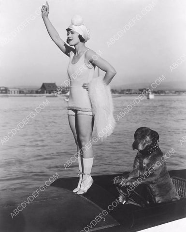 Marie Prevost standing on her boat while the dog drives 8b20-9804