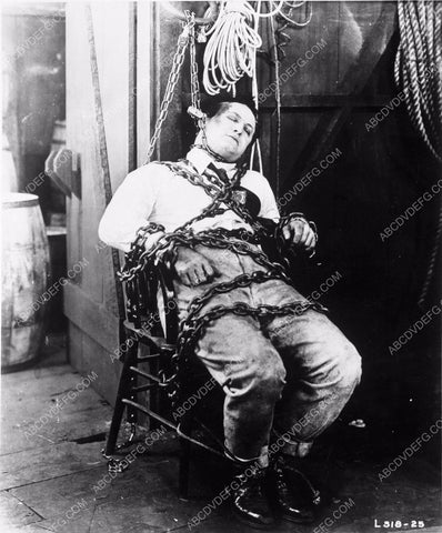 Harry Houdini chained to a chair from silent film harhou-07