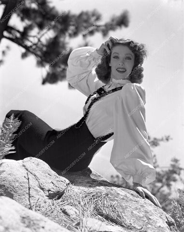 Loretta Young posing on rocks lyoung-30