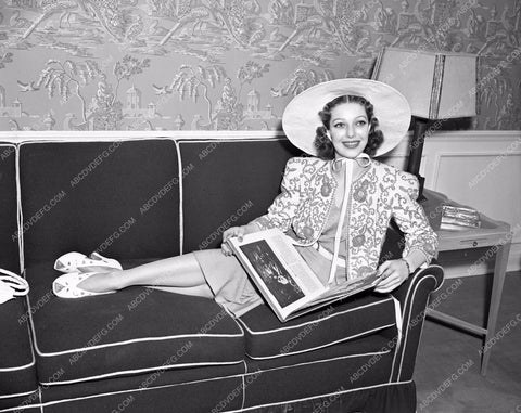 Loretta Young reclining on sofa lyoung-48