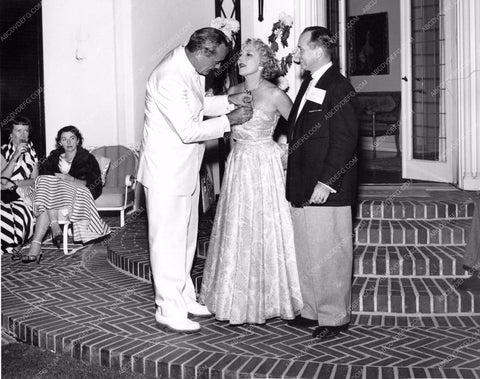 Mary Pickford getting corsage or medal at Pickfair mpick-44