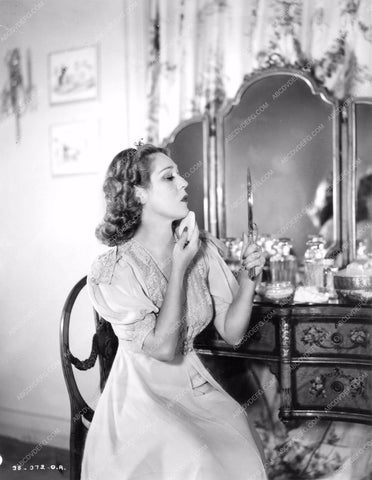 Mary Pickford applying make-up in bedroom at Pickfair mpick-46