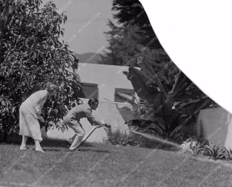 Mary Pickford Buddy Rogers squirting the dog at Pickfair mpick-58
