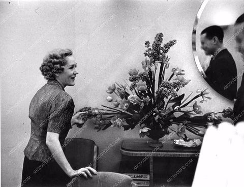 Mary Pickford checking the flowers at Pickfair mpick-67