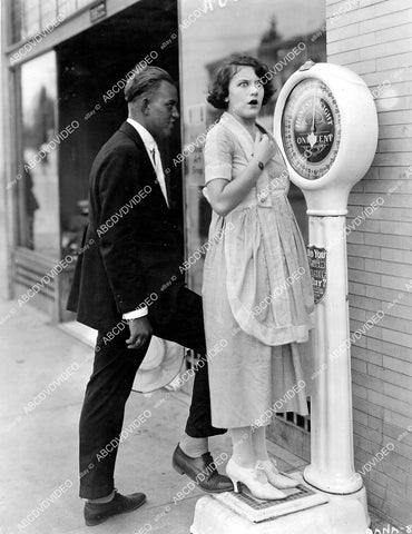 crp-11737 1920 Viola Dana gets surprise on scale when friend puts foot on scale for extra weight crp-11737