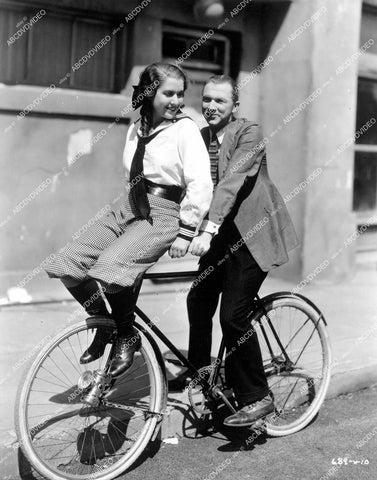 crp-12455 1933 Mae Clarke & Lee Tracy on bicycle behind the scenes film Turn Back the Clock crp-12455