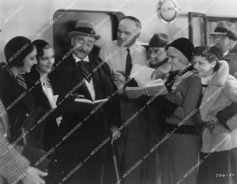 crp-13784 1931 candid Adolphe Menjou signs autographs for Mary Carlisle, Lilian Bond, Cliff Edwards, director Harry Beaumont others film The Great Lover crp-13784