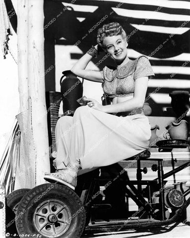 crp-14425 1945 stunning Evelyn Keyes relaxing sitting on camera dolly on set film A Thousand and One Nights crp-14425