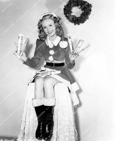crp-15089 1945 Santa's sexy helper Janet Blair stuffing stockings for vintage Christmas Pinup pose crp-15089