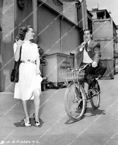 crp-15237 1947 Gloria Henry hikes upskirt hitches bicycle ride Ron Randell Columbia Studios backlot crp-15237