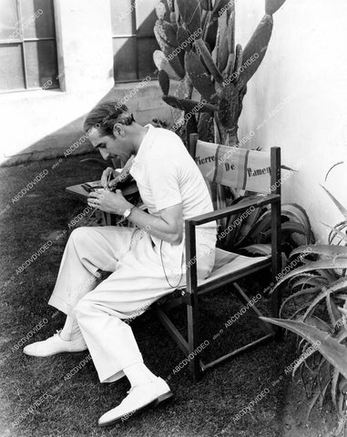 crp-15569 circa 1929 Pierre de Ramey candid in his chair on set unknown film crp-15569