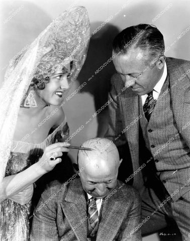 crp-17016 1928 Sylvia Beecher & director Nick Grinde draw on bald guys head silent film Beyond the Sierras crp-17016
