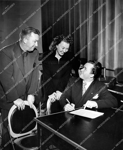 crp-17354 circa 1942 Armand Schaefer, Ginny Simms, Michael Dowd signs w Republic Pictures crp-17354