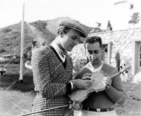 crp-18790 1927 William Haines signs somebody's violin on set silent film Spring Fever crp-18790