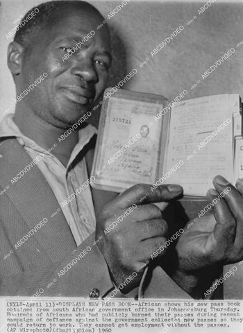crp-01943 1960 apartheid South Africa Johannesburg African shows new passbook from government crp-01943