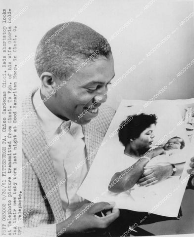 crp-01944 1961 baseball player Chico Cardenas Cincinnati Reds gets telephoto of newborn son & wife Gloria crp-01944