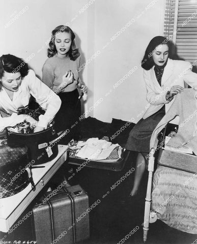 crp-00361 girls unpacking luggage Dusty Anderson w friends B.J. and Eileen crp-00361