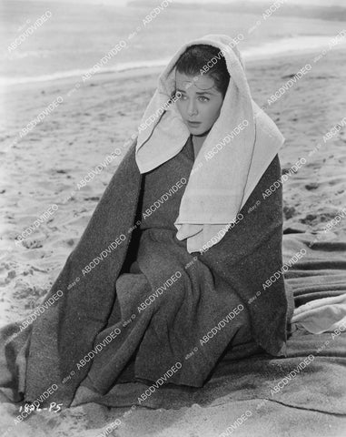 crp-03767 1957 photo Marianne Cook huddles in a blanket on beach film Four Girls in Town crp-03767