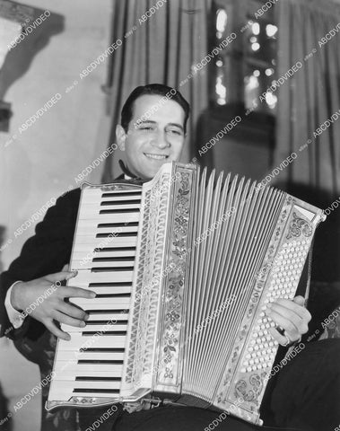 crp-03775 1931 Donald Cook w his trusty acordeon film Safe in Hell crp-03775
