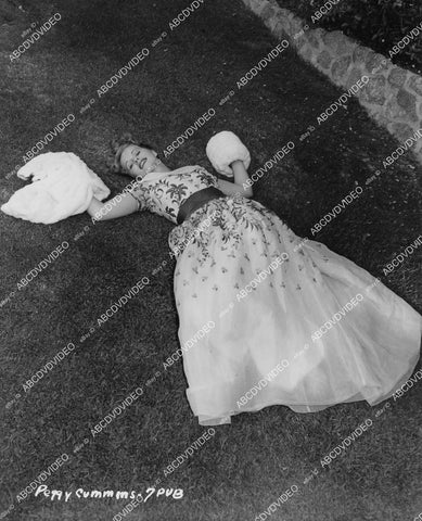 crp-03873 1950's beautiful Peggy Cummins displays new fashion laying in the grass crp-03873
