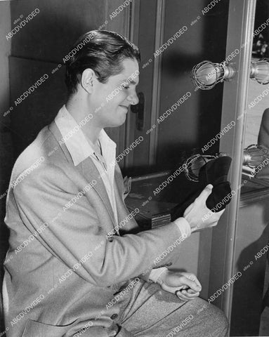 crp-03884 1950's Bob Cummings in dressing room checking out baseball cap crp-03884
