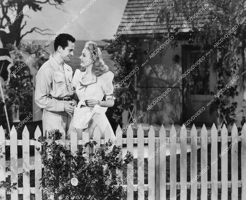 crp-04496 1944 Larry Parks, Lynn Merrick at white picket fence film Stars on Parade crp-04496
