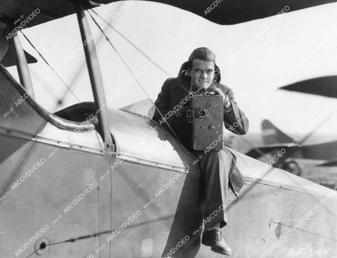 crp-04633 1928 Nick Stuart in biplane w newsreel camera silent film News Parade crp-04633