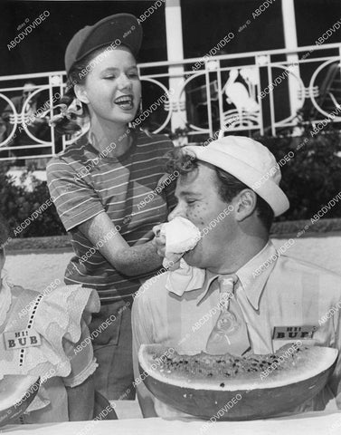 crp-05137 1946 Sheila O'Malley wipes face Ross Hunter watermelon eating contest at Bubble Gum party crp-05137
