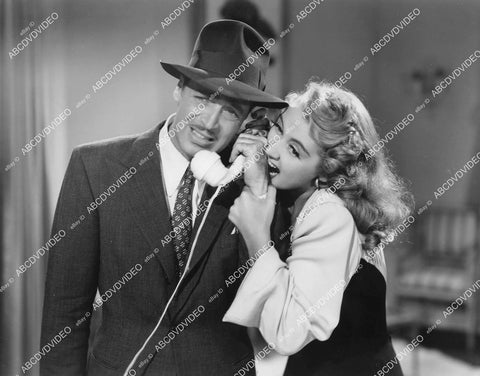 crp-05887 1941 Joan Blondell bites John Howard film Three Girls About Town crp-05887
