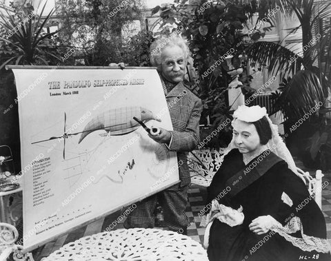 crp-00635 1969 Warren Mitchell w wax replica Queen Victoria explains airship film The Best House in London crp-00635