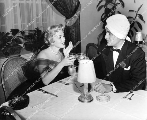 crp-06779 1953 Eva Gabor, Tom Conway toasting film scenes Paris Model crp-06779