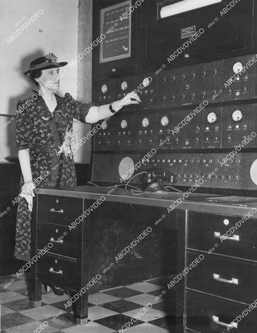 crp-00730 1937 New San Francisco Mint Alarm System director Nellie Tayloe Ross inspects central control board crp-00730