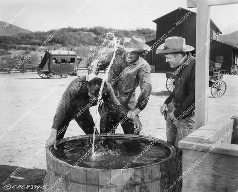 crp-00831 1957 outlaws Robert Wilke William Leslie give Jay Silverheels a dunking film Return to Warbow crp-00831