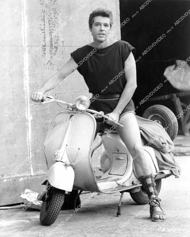 crp-09082 1960 Kerwin Mathews on Vespa scooter Rome's Cinecitta Studios film The Warrior Empress crp-09082