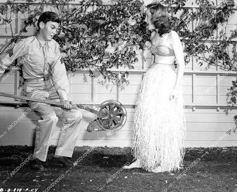 crp-09882 1945 Conrad Janis takes lawnmower to Janis Wilson in her grass skirt film Snafu crp-09882