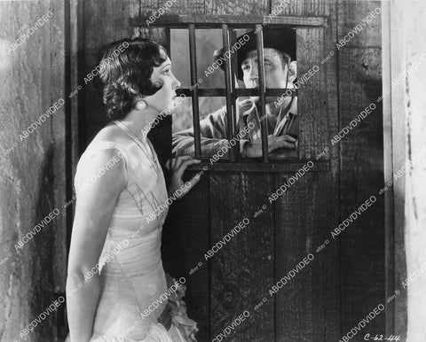 crp-00989 1930 Carmelita Geraghty, Buck Jones behind bars film Men Without Law crp-00989