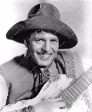 Warner Baxter playing the guitar film Under the Pampas Moon wbax-64