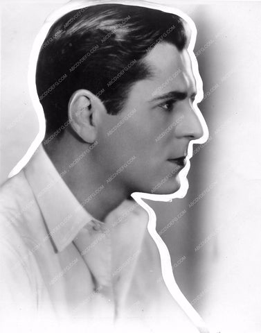 handsome Warner Baxter portrait with newspaper outline wbax-76